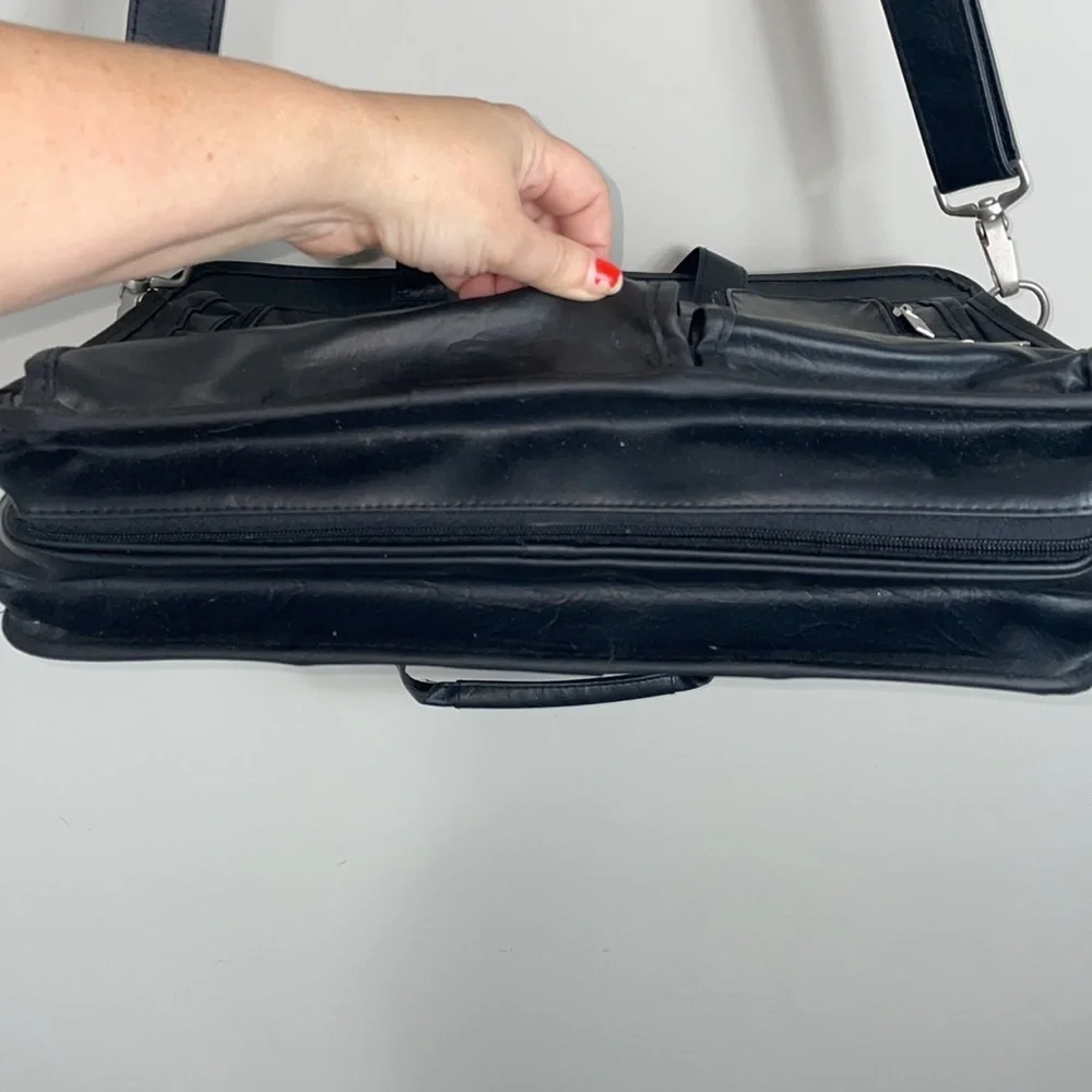 Soft bodied faux leather briefcase lots of pockets and crossbody strap
